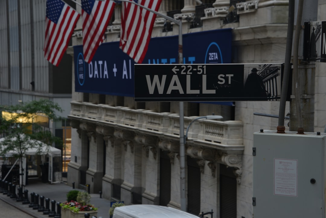 a street sign on wall street in new york city