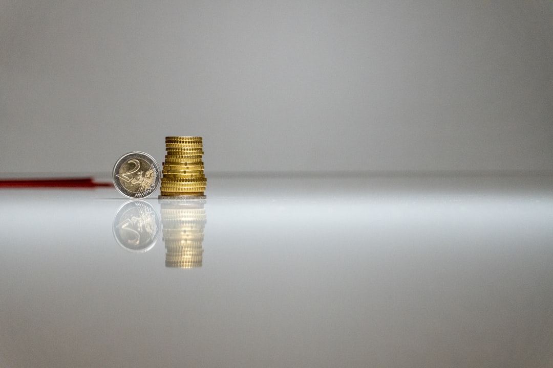 a stack of coins sitting on top of a table